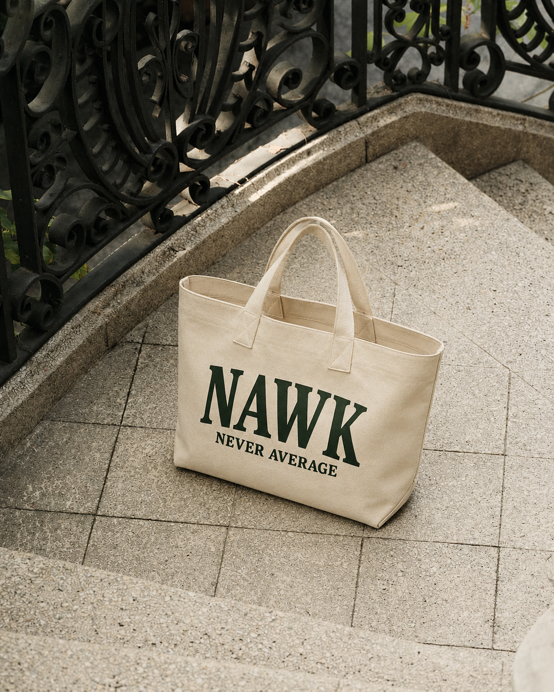 Natural NAWK canvas tote photographed on stone steps